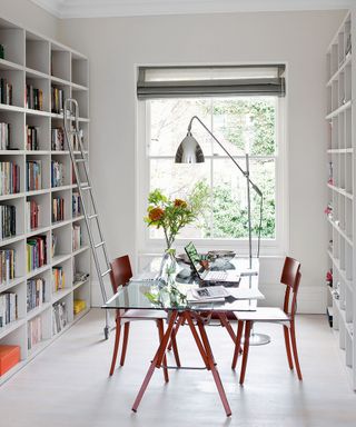All white light bright and airy office study and library, sash window, glass top table / desk, chrome designer Task lamp light