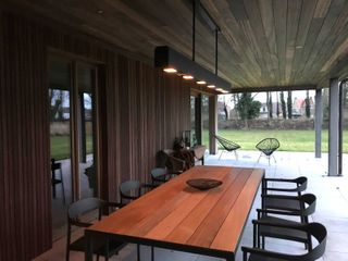 strip light over outdoor dining table from Cuckooland