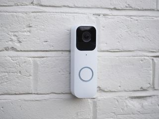 a blink video doorbell on a white wall