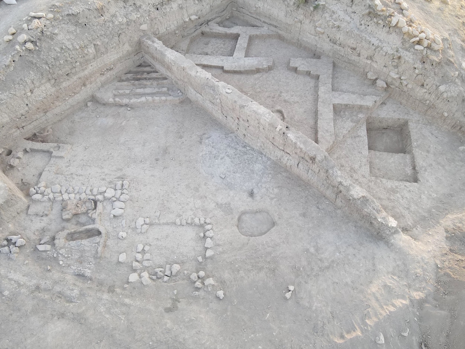 an aerial view of an excavated building showing the floorplan