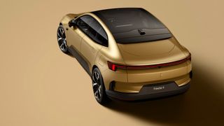 Rear view of a gold Polestar 4 car with no rear window showing panoramic roof glass