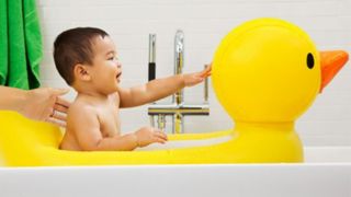 Image of a large yellow inflatable duck as bathtub