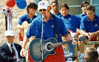 Former USA defender Alexi Lalas performing for fans in 1994.