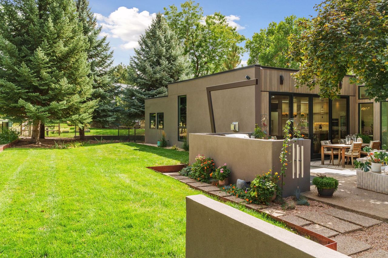 A modern home for sale in Boulder, Colorado by a golf course.