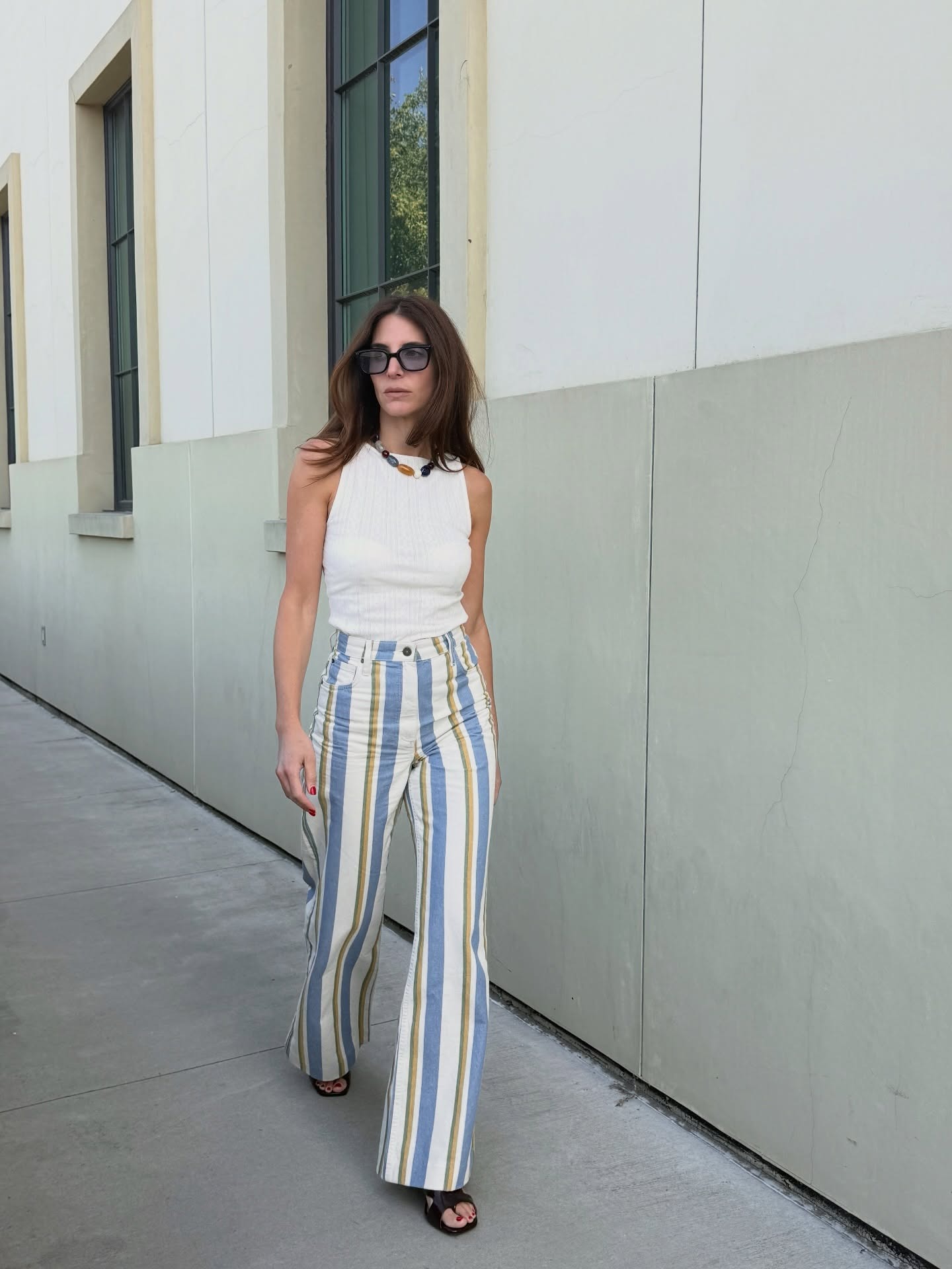 Influencer wearing vertical striped pants with sandaks