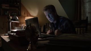 Pierce Brosnan screams at computer in Bag Of Bones
