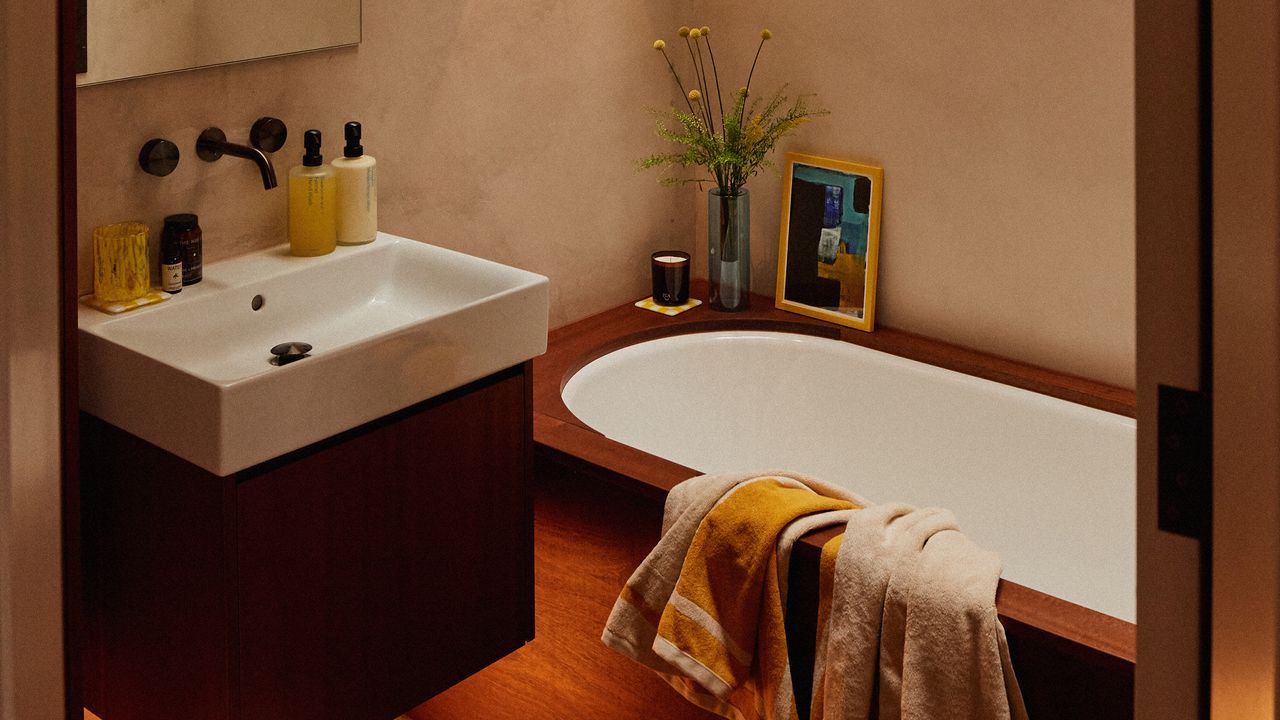 Terracotta bathroom with bath and basin unit