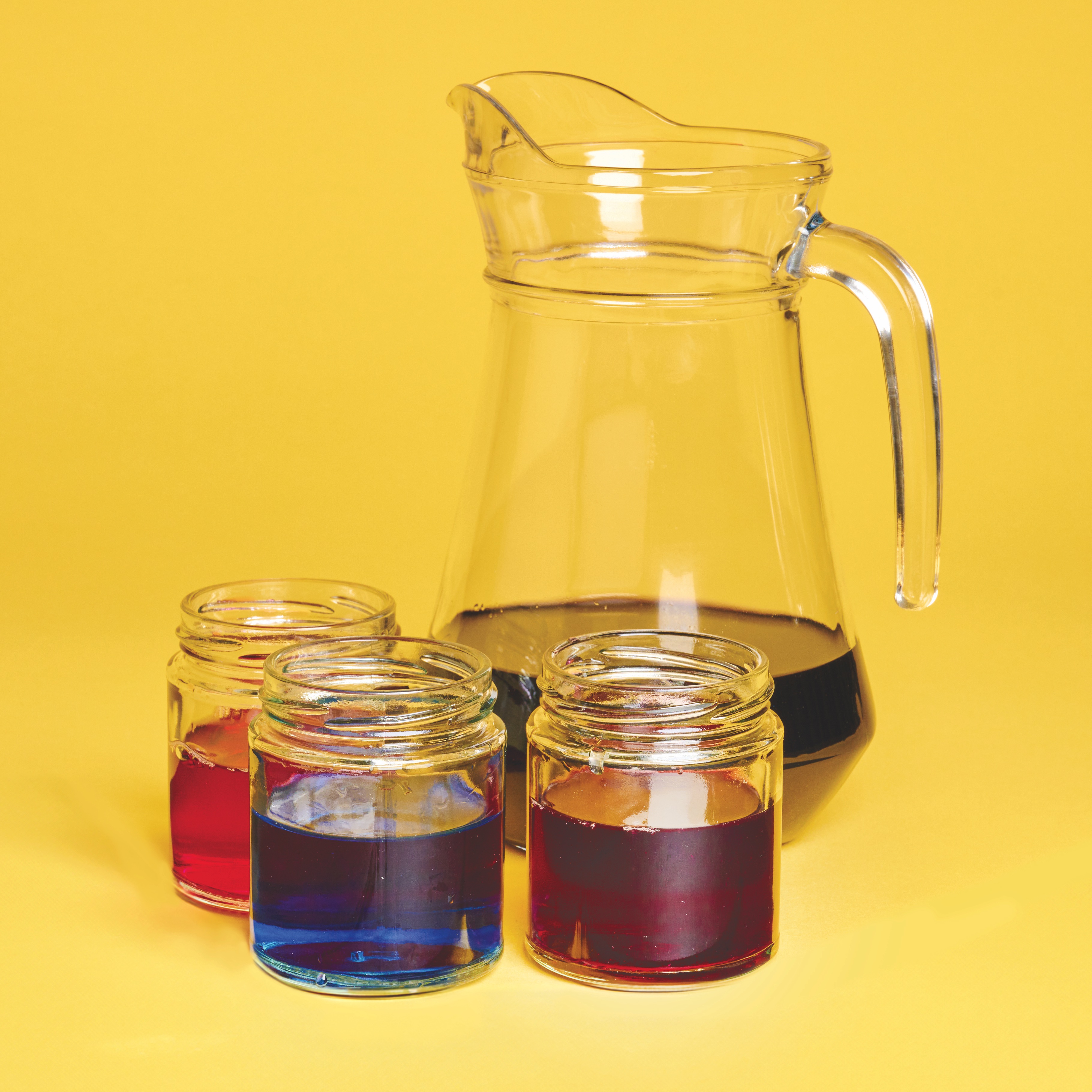 Liquids of different colours in jars