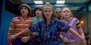 stranger things eleven holding group back