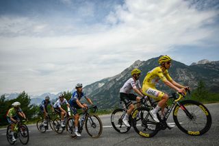 Tadej Pogacar wearing the overall leader's yellow jersey among the field at the Tour de France