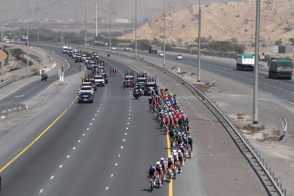 AL MARJAN UNITED ARAB EMIRATES FEBRUARY 24 A general view of Jasper Philipsen of Belgium and Team AlpecinFenix green points jersey and the peloton passing through higway during the 4th UAE Tour 2022 Stage 5 a 182km stage from Ras al Khaimah Corniche to Al Marjan Island UAETour WorldTour on February 24 2022 in Al Marjan United Arab Emirates Photo by Tim de WaeleGetty Images