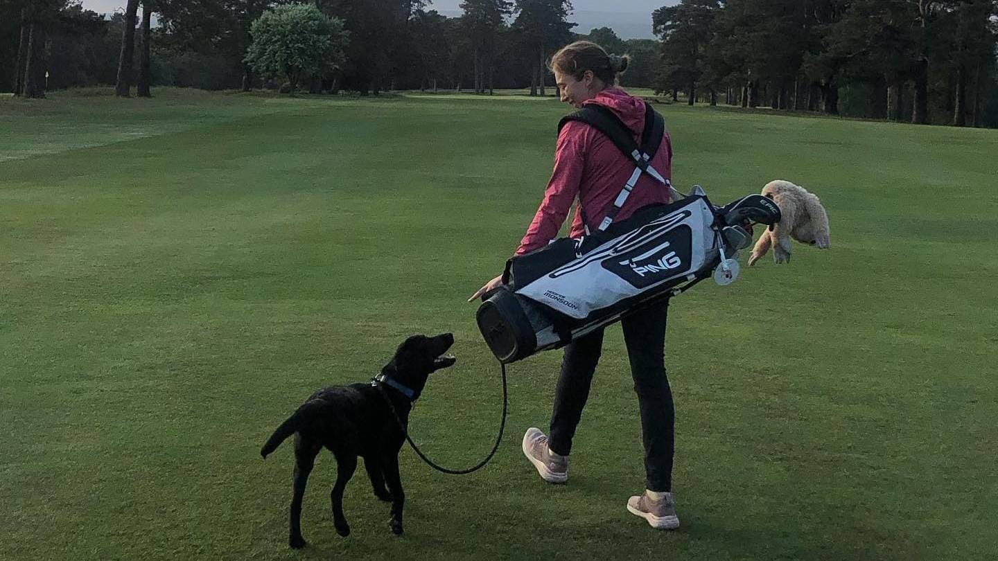 Becky Gee on the golf course with her dog