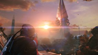 A screenshot from Mass Effect 3 showing Commander Shepard from behind, staring down a massive alien Reaper as it invades from space.