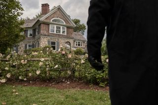 A mysterious figure watches the Brannock house in The Watcher