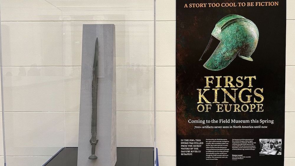 A photo of a sword from the Bronze Age and a poster advertising an upcoming museum exhibition. 