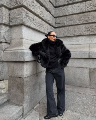 Influencer wears a fluffy coat.