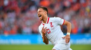 Matty Cash of Aston Villa celebrates after scoring for Poland against Netherlands in the UEFA Nations League.