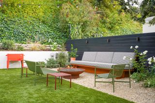 backyard with lounge seating and black fence by Kate Anne Designs