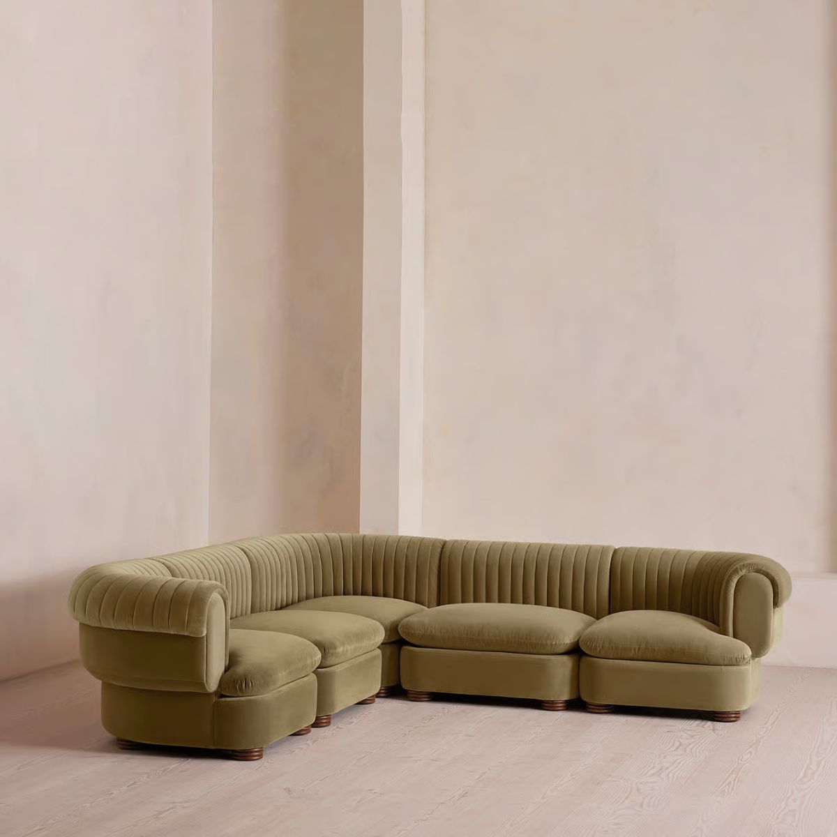 Green corner sofa in velvet