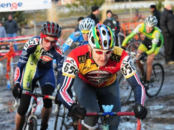 Peter Ozolins (Finger Lakes Cycling) leading a group of riders on a wide track