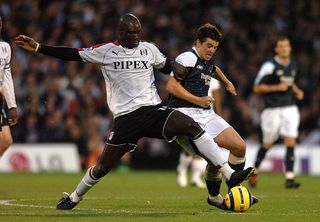 Papa Bouba Diop tackles Joey Barton while playing for Fulham against Manchester City, 2005