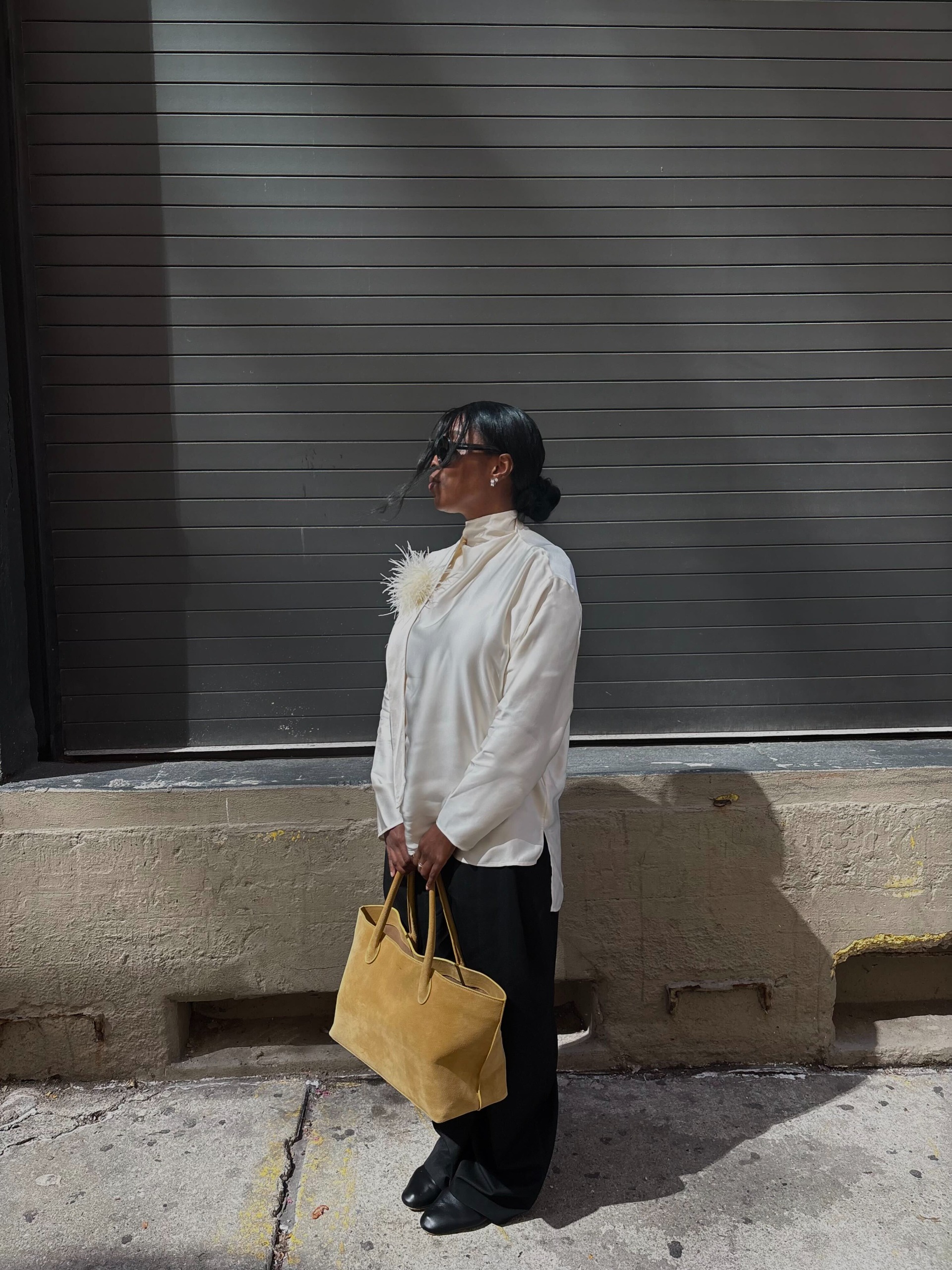 Cortne Bonilla carrying a Li&amp;eacute; Studio laptop bag