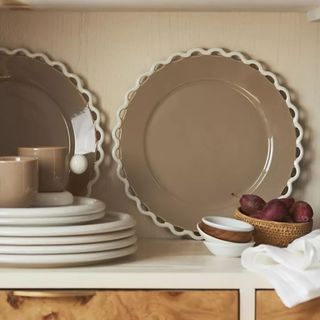 Brown plates with a white scalloped edge