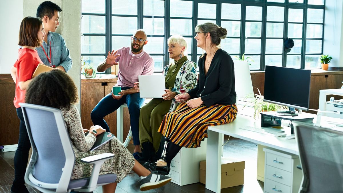 Group of mixed age and multi ethnic colleagues in discussion