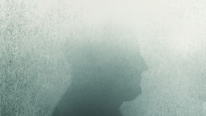 an illustration of a man's silouette, with the top half of the head fading as if into a fog