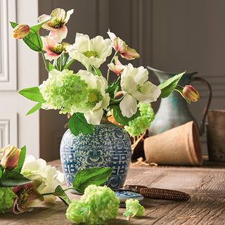 blue flower vase with water jar