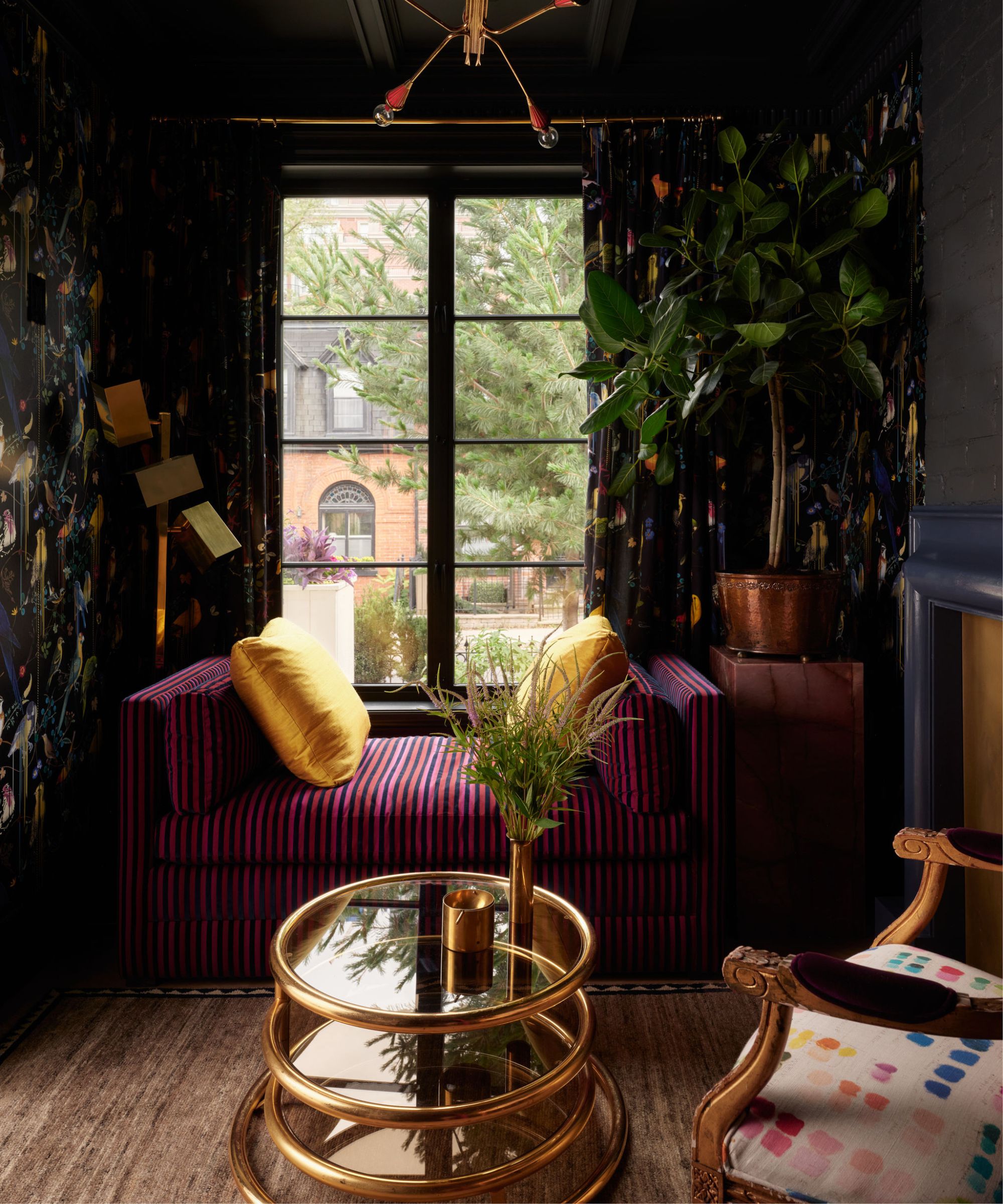 a dark and moody parlour room with painted ceiling and statement Christian Lacroix wallpaper