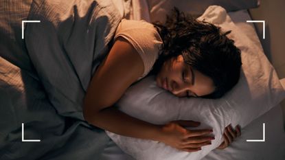 Woman sleeping in white bedsheets at night after learning how to fall asleep fast