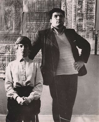 Freda and Eduardo Paolozzi in front of test sheets and textile designs, London, 1951.
