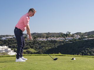 Anders Mankert from down the line demonstrating the correct hand position and posture for the driving setup