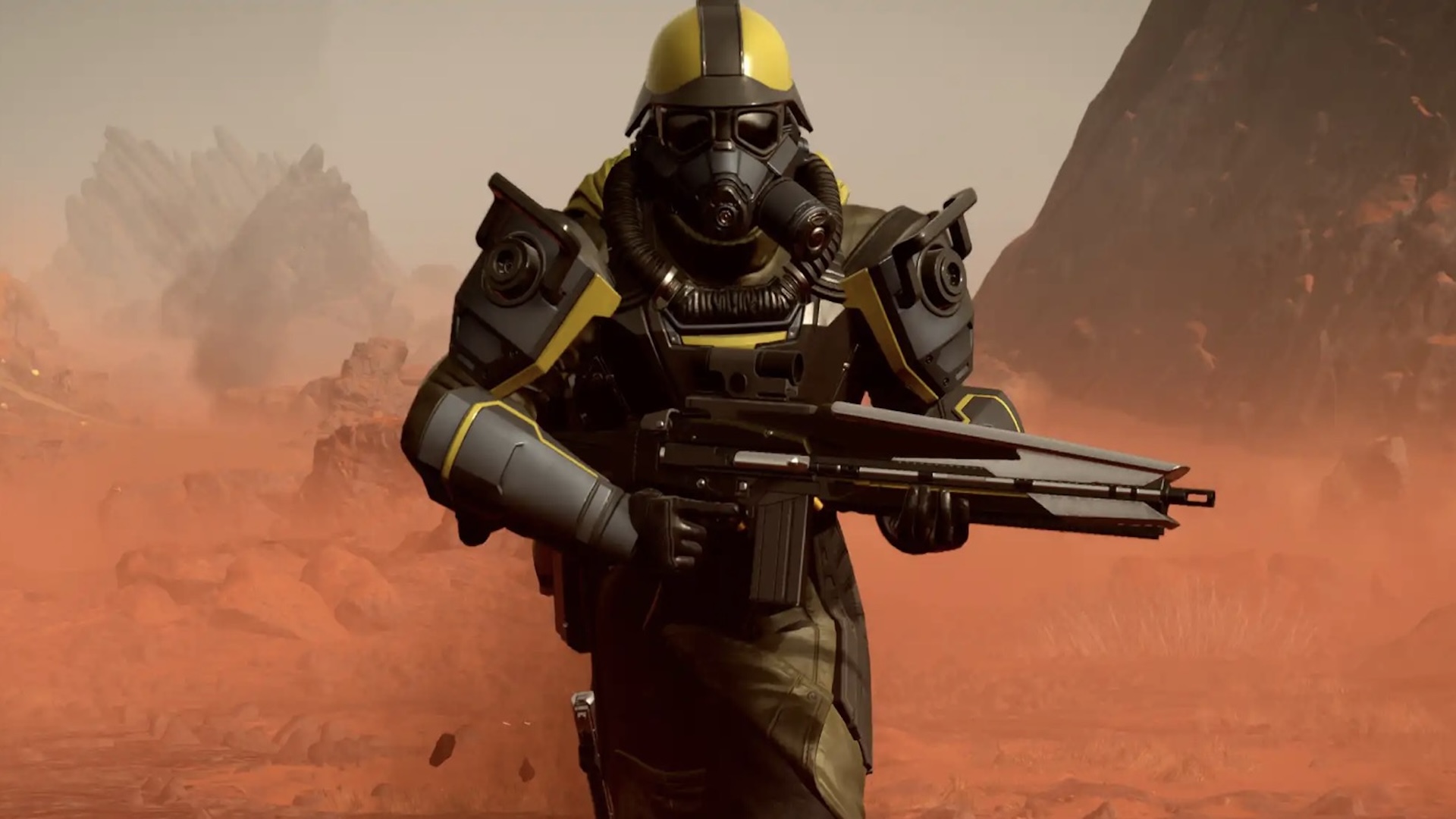 Хеллдайвер носит желто-черную броню Ground Breaker CE-27 и бежит к камере по пустынной планете