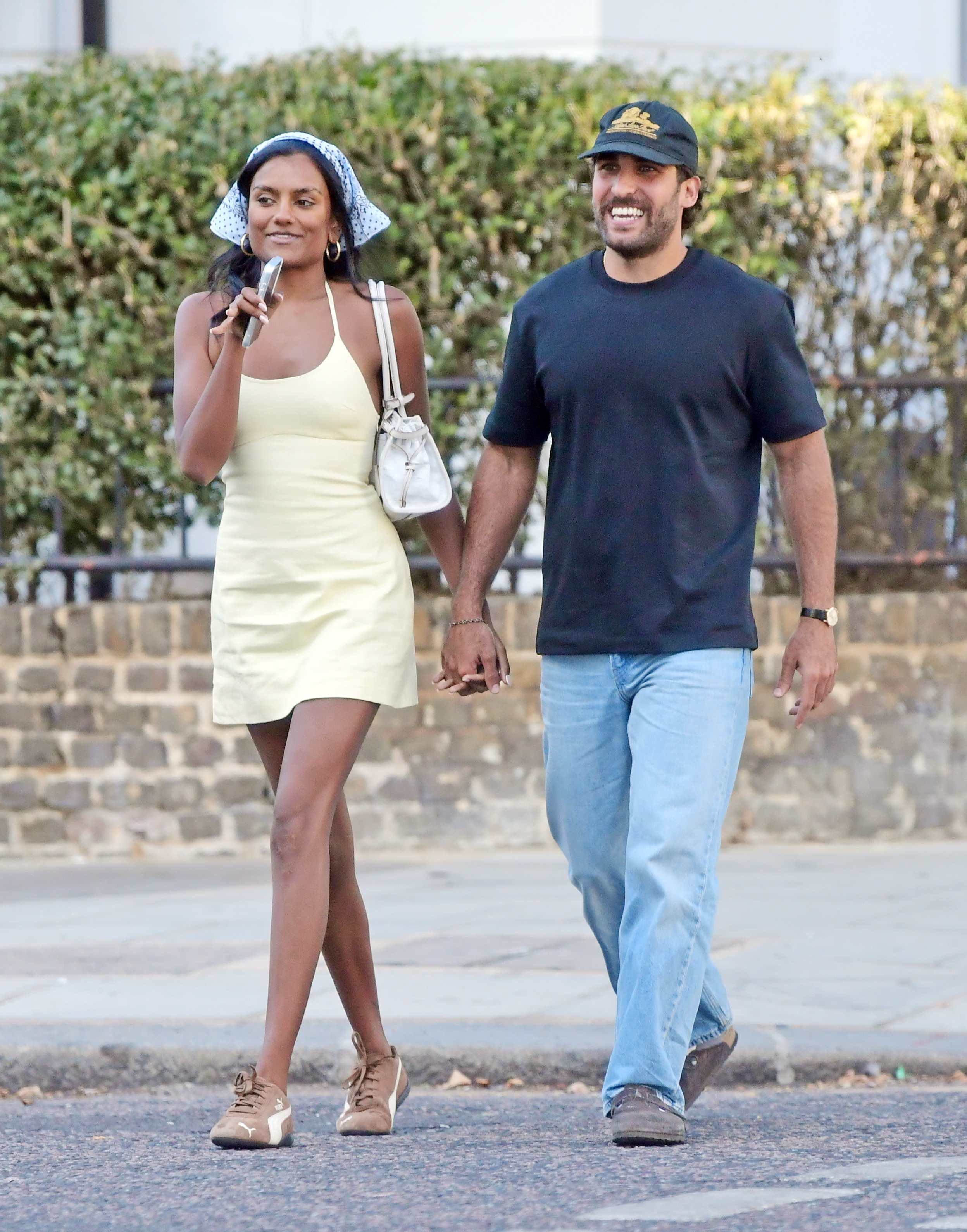 Simone Ashley styled a butter yellow summer dress with the bandana trend and Puma Speedcat sneakers