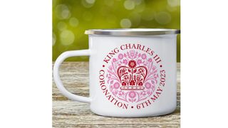 An enamel King Charles coronation mug.