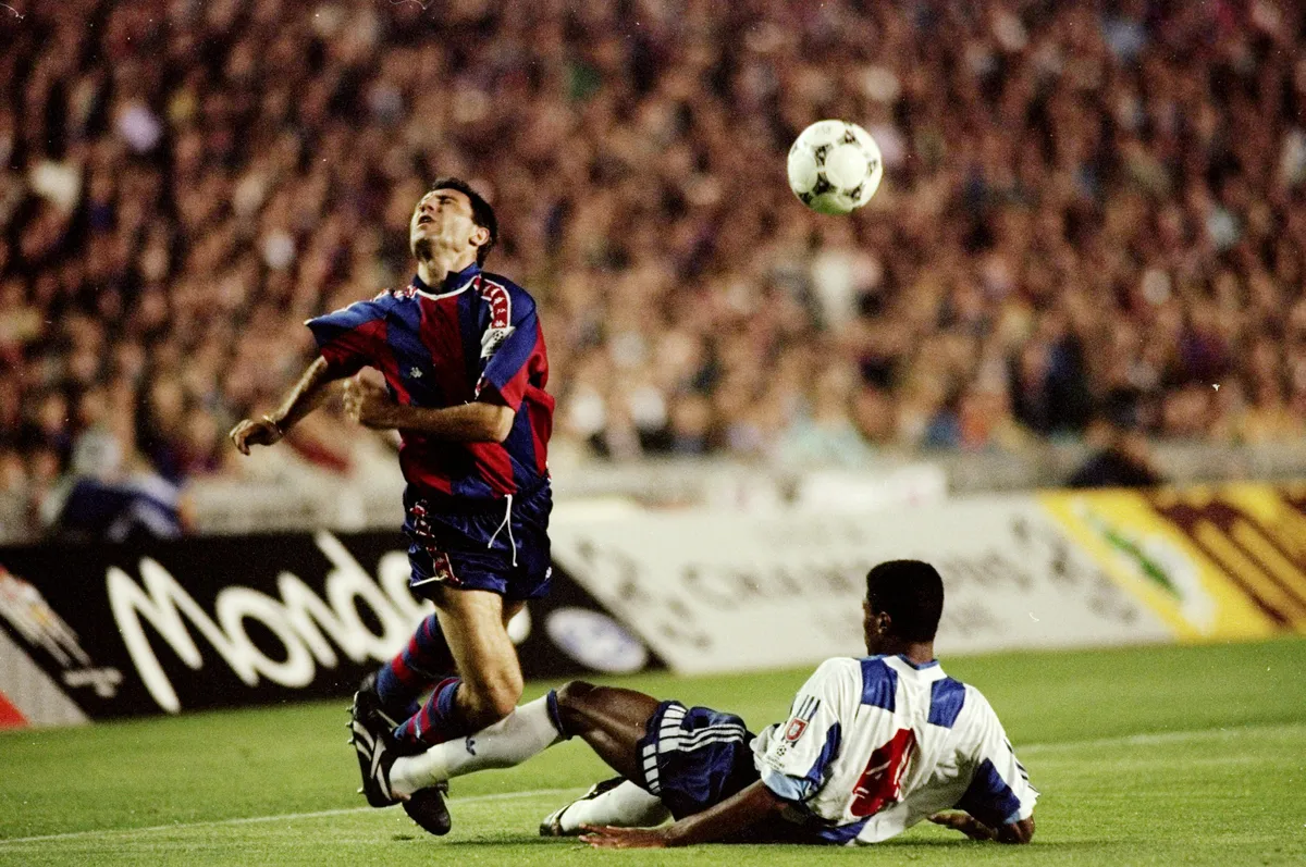 Barcelona's Hristo Stoichkov is brought down during a European Cup semi-final against Porto at Camp Nou in 1994.