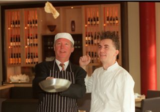 Gary Rhodes flipping pancakes with Sir Alex Ferguson