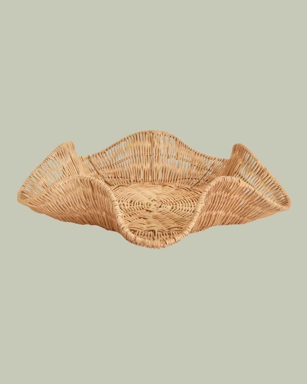 A series of sculptural rattan decorative items, including place mats, cake stands, laundry baskets, lights, napkin rings, and storage units.