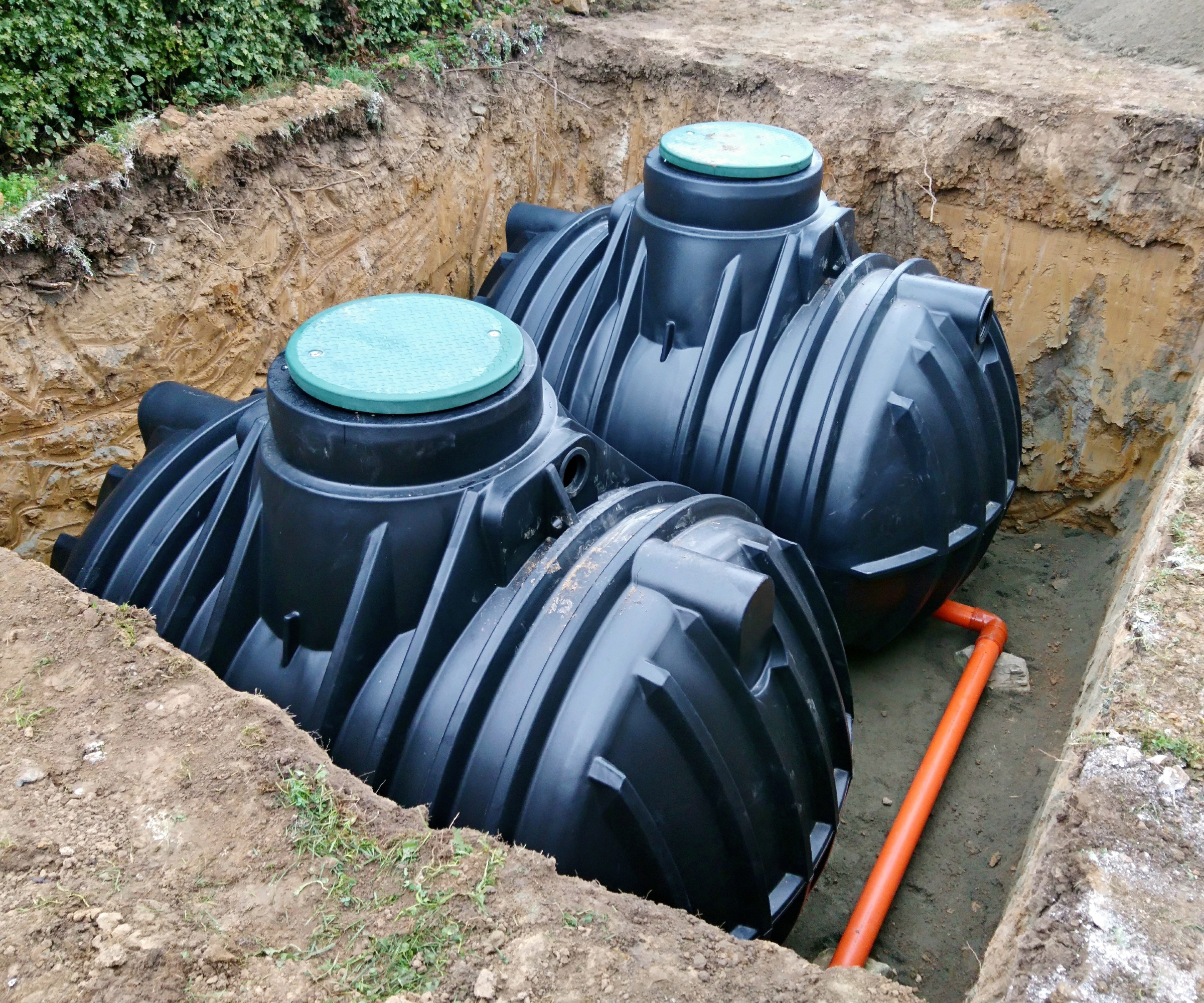 rainwater harvesting tanks sunk into ground