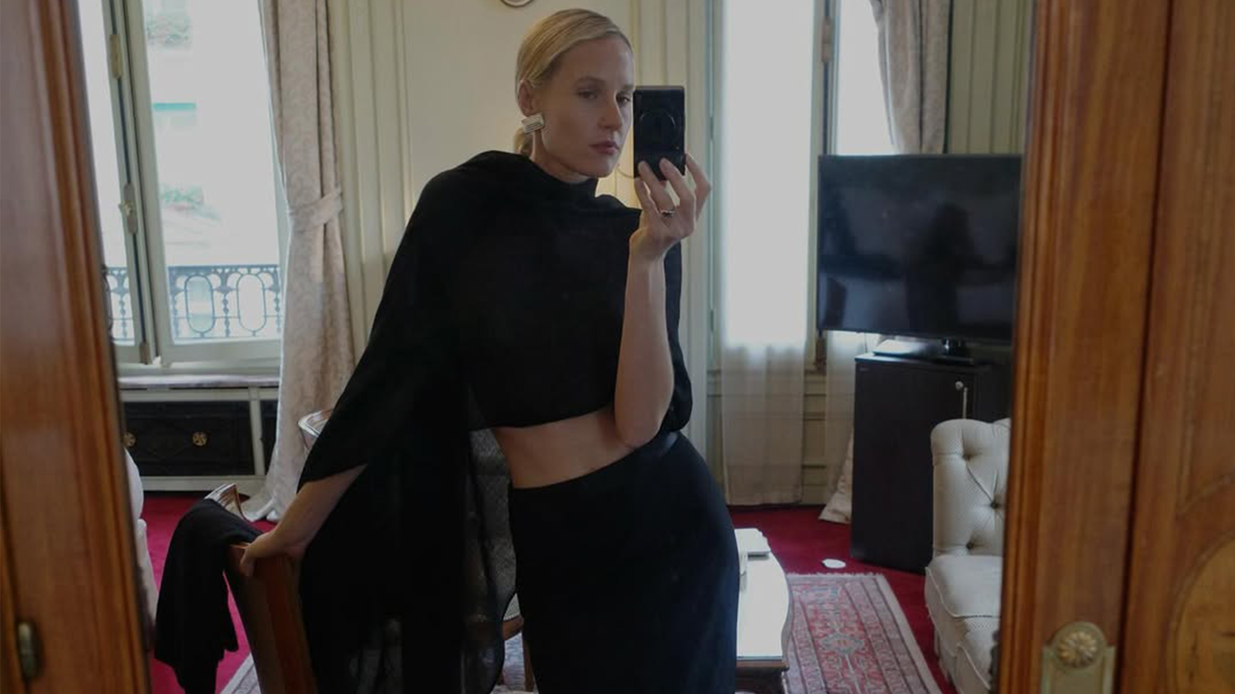 Elly McGaw wearing a black poncho.