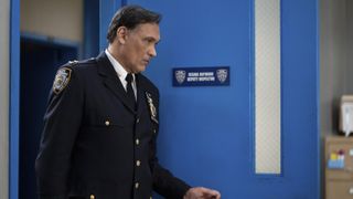 Jimmy Smits as Chief John Suarez walking into an office in East New York