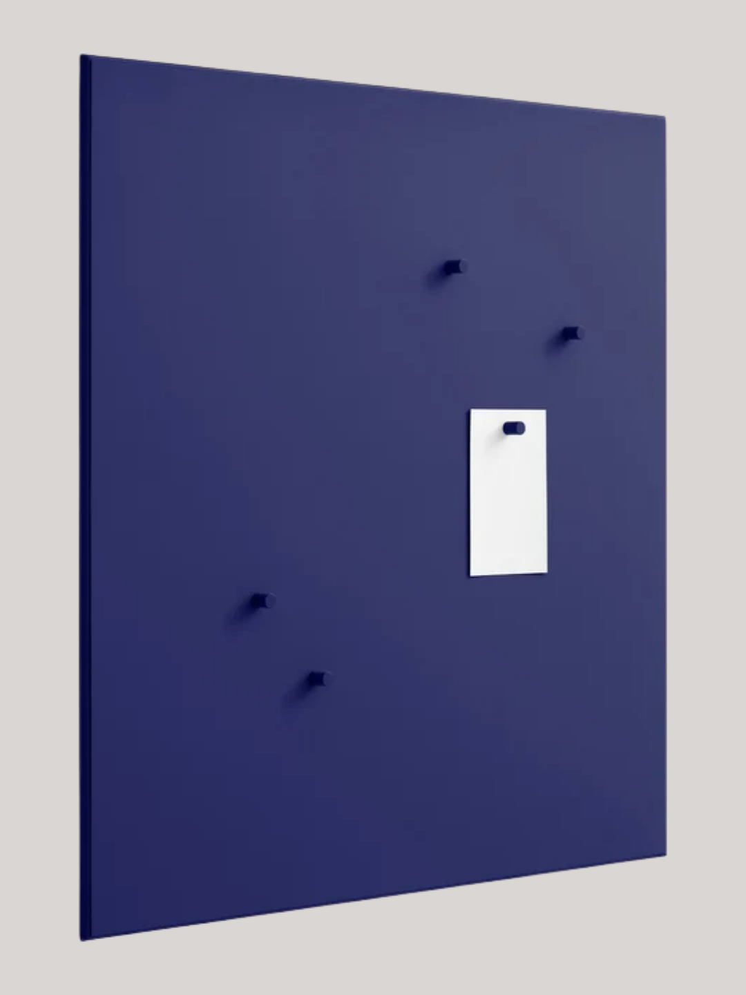 A cobalt blue noticeboard with five magnets from Montana Furniture