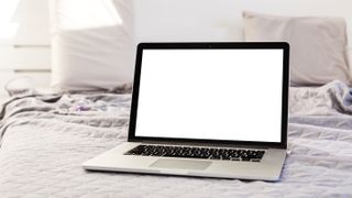 A laptop placed on a mattress