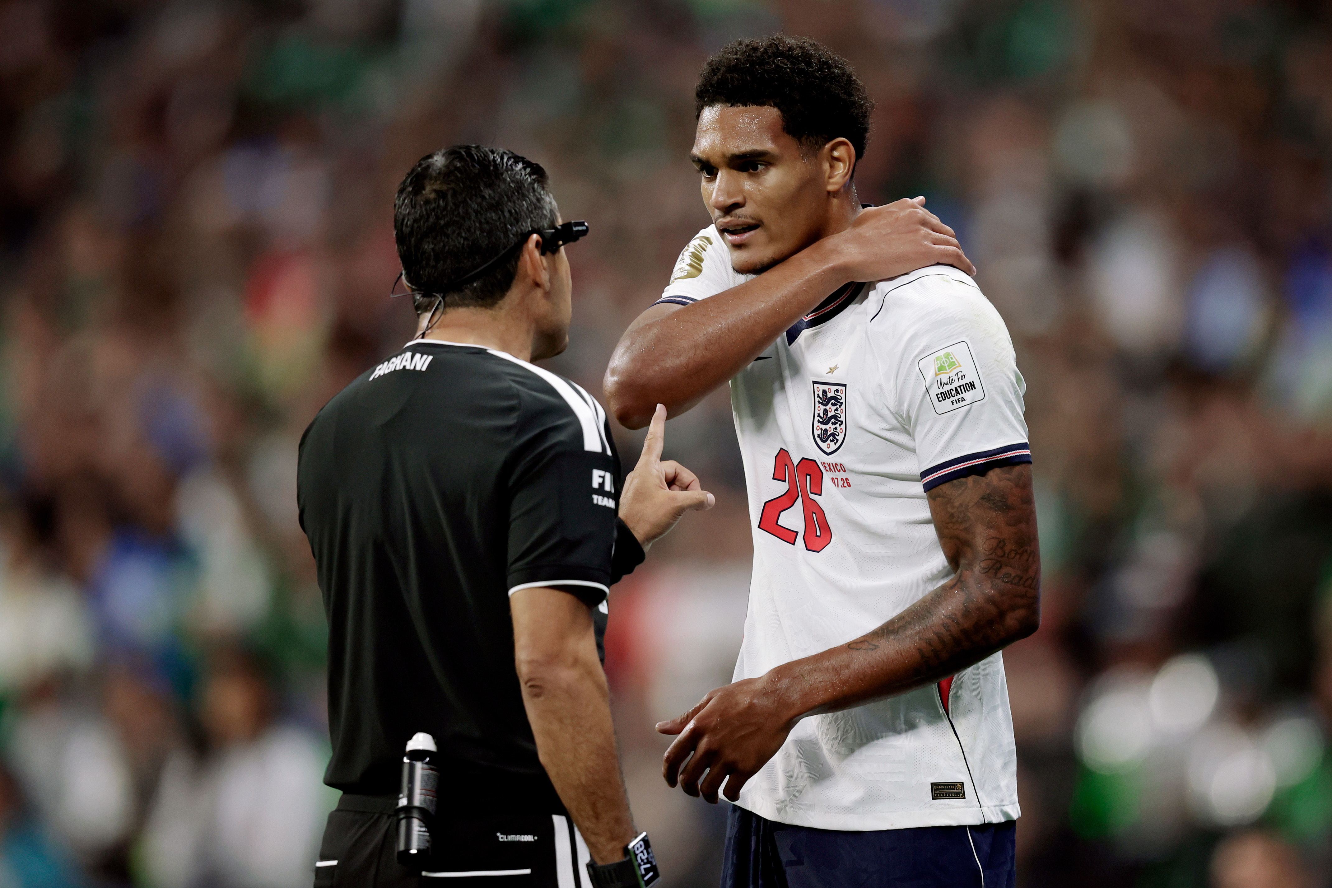 MEXICO CITY, MEXICO - JULY 5: Referee Alireza Faghani argues with Jarell Quansah of England during the World Cup match between Mexico v England at the Mexico City Stadium on July 5, 2026