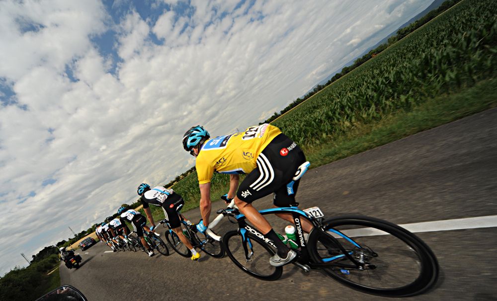 Bradley Wiggins takes shelter behind his Team Sky train