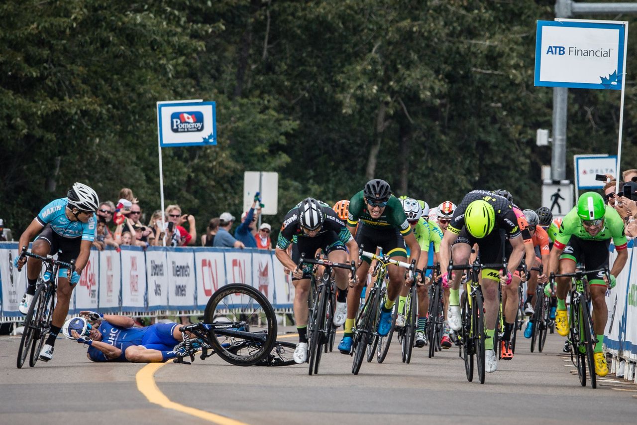 Travis McCabe hits the deck in a crash during stage 2 at the Tour of Alberta