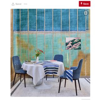 dining room with printed wall and dining table with chairs