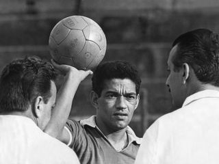 Garrincha poses with a ball in 1966.